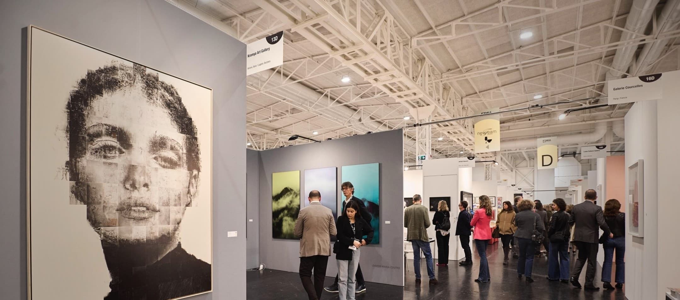 Gallery walls and visitors inside Superstudio Maxi during an exhibition